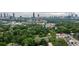 Expansive aerial view of Atlanta's skyline surrounded by a canopy of lush trees at 966 Blue Ridge Ne Ave, Atlanta, GA 30306