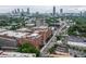 Aerial view of the cityscape with industrial buildings and lush greenery in the foreground at 966 Blue Ridge Ne Ave, Atlanta, GA 30306