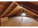 Unfinished attic space with exposed wooden beams, offering potential for storage or renovation at 966 Blue Ridge Ne Ave, Atlanta, GA 30306