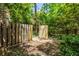 A shady backyard enclosed by a wooden fence with a small, cleared area at 966 Blue Ridge Ne Ave, Atlanta, GA 30306