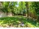 View of a backyard featuring lush greenery and a wooden fence at 966 Blue Ridge Ne Ave, Atlanta, GA 30306