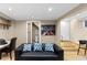 Basement living area featuring sofa, art, desk, and access to bathroom and stairs at 966 Blue Ridge Ne Ave, Atlanta, GA 30306