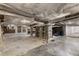Spacious unfinished basement with exposed ceiling, brick accents, and concrete flooring, perfect for storage or renovation at 966 Blue Ridge Ne Ave, Atlanta, GA 30306