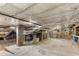 Unfinished basement space with exposed brick, ductwork, and concrete floor, offering potential for customization at 966 Blue Ridge Ne Ave, Atlanta, GA 30306