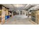 Basement featuring open shelving, brick foundation, concrete floor, and potential for storage or renovation at 966 Blue Ridge Ne Ave, Atlanta, GA 30306