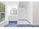Modern bathroom featuring a shower and vanity with sleek fixtures and blue-tiled floors, creating a refreshing space at 966 Blue Ridge Ne Ave, Atlanta, GA 30306