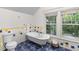 Bathroom featuring a clawfoot tub and windows with natural light and colorful tile accents at 966 Blue Ridge Ne Ave, Atlanta, GA 30306