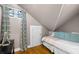 Attic bedroom space with hardwood floors, a sloped ceiling, and daybed at 966 Blue Ridge Ne Ave, Atlanta, GA 30306