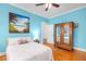 Light and airy bedroom has a comfy bed and stylish antique mirrored wardrobe closet at 966 Blue Ridge Ne Ave, Atlanta, GA 30306
