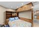 Cozy bedroom featuring built-in shelving, overhead lighting, and a colorful quilt, creating a warm and inviting space at 966 Blue Ridge Ne Ave, Atlanta, GA 30306