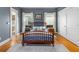 Bedroom featuring hardwood flooring, two large windows, and an ensuite bathroom at 966 Blue Ridge Ne Ave, Atlanta, GA 30306