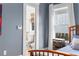 Cozy bedroom featuring blue walls with an ensuite bathroom, natural light and hardwood floors at 966 Blue Ridge Ne Ave, Atlanta, GA 30306