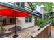 Outdoor deck space perfect for entertaining or relaxing with a red umbrella and backyard access at 966 Blue Ridge Ne Ave, Atlanta, GA 30306