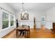 Bright dining room with hardwood floors, white wainscoting, chandelier, and large windows at 966 Blue Ridge Ne Ave, Atlanta, GA 30306