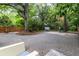 Large driveway with ample parking surrounded by mature trees and landscaping at 966 Blue Ridge Ne Ave, Atlanta, GA 30306
