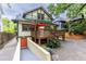 Charming home featuring a spacious wooden deck, basement entrance and brick driveway at 966 Blue Ridge Ne Ave, Atlanta, GA 30306
