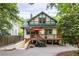 Charming home featuring a spacious wooden deck, basement entrance and brick driveway at 966 Blue Ridge Ne Ave, Atlanta, GA 30306
