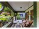 Relaxing porch area with a swing, cushioned seating, and outdoor decor creates a serene atmosphere at 966 Blue Ridge Ne Ave, Atlanta, GA 30306