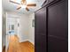Hallway with hardwood floors and a black storage cabinet at 966 Blue Ridge Ne Ave, Atlanta, GA 30306
