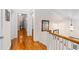 Upstairs hallway with hardwood floors and white trim, leading to various rooms at 966 Blue Ridge Ne Ave, Atlanta, GA 30306