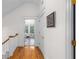 Hallway with hardwood floors and white trim leading to a bathroom with views to the backyard at 966 Blue Ridge Ne Ave, Atlanta, GA 30306