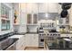 A modern kitchen with stainless steel appliances, custom cabinets, and black countertops at 966 Blue Ridge Ne Ave, Atlanta, GA 30306