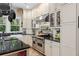 Kitchen with stainless appliances, custom cabinets, a tile backsplash, and plenty of counter space at 966 Blue Ridge Ne Ave, Atlanta, GA 30306