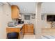 Basement kitchenette featuring wood cabinets, granite countertops, a sink, and stainless steel appliances at 966 Blue Ridge Ne Ave, Atlanta, GA 30306