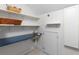 Laundry room with open shelving, sink, and storage cabinets at 966 Blue Ridge Ne Ave, Atlanta, GA 30306