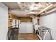 Functional laundry area with washer, dryer, utility sink, storage shelves, and durable wood-look flooring at 966 Blue Ridge Ne Ave, Atlanta, GA 30306