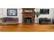 Cozy living room featuring a fireplace, hardwood floors, and stylish decor at 966 Blue Ridge Ne Ave, Atlanta, GA 30306