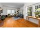 Bright living room featuring large windows, hardwood floors, and built-in bookshelves at 966 Blue Ridge Ne Ave, Atlanta, GA 30306