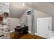 Attic office space featuring exposed brick, hardwood floors, and a sloped ceiling at 966 Blue Ridge Ne Ave, Atlanta, GA 30306