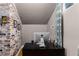 Attic office space with desk, exposed brick, and hardwood floors at 966 Blue Ridge Ne Ave, Atlanta, GA 30306