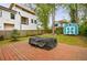 Backyard featuring a wood patio, green grass, a storage shed, and a privacy fence at 1027 Kirkwood Se Ave, Atlanta, GA 30316