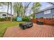 Backyard featuring a wood patio, green grass, a storage shed, and a privacy fence at 1027 Kirkwood Se Ave, Atlanta, GA 30316