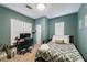 Cozy bedroom featuring a full bed, neutral carpet, and a work-from-home setup at 1027 Kirkwood Se Ave, Atlanta, GA 30316