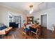 Cozy dining room adjacent to the living room featuring hardwood floors and natural light at 1027 Kirkwood Se Ave, Atlanta, GA 30316
