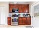 Traditional kitchen featuring stainless steel appliances and granite countertops at 1027 Kirkwood Se Ave, Atlanta, GA 30316