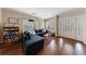 Comfortable living room with dark wood floors, a cozy couch, and natural light at 1027 Kirkwood Se Ave, Atlanta, GA 30316