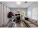 A bright home office featuring a treadmill, a sofa, and lots of natural light at 1027 Kirkwood Se Ave, Atlanta, GA 30316