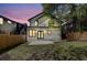 Spacious backyard featuring a manicured lawn and a full wooden fence surrounding the home during twilight at 1456 S Gordon Sw St, Atlanta, GA 30310
