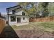 Spacious backyard featuring a manicured lawn and a full wooden fence surrounding the home at 1456 S Gordon Sw St, Atlanta, GA 30310