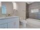Bathroom boasts a stylish vanity, modern fixtures, and a tiled shower/bath with gold hardware at 1456 S Gordon Sw St, Atlanta, GA 30310
