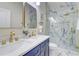 Elegant bathroom with double sinks, gold hardware, and a luxurious marble shower at 1456 S Gordon Sw St, Atlanta, GA 30310