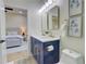Stylish bathroom with double vanity, gold fixtures, and a view of the bedroom at 1456 S Gordon Sw St, Atlanta, GA 30310