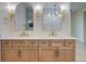 Bathroom boasts double sinks, sconces, a vanity with modern fixtures, and framed mirrors at 1456 S Gordon Sw St, Atlanta, GA 30310