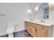 Bathroom features double sinks, a vanity with modern fixtures, and framed mirrors at 1456 S Gordon Sw St, Atlanta, GA 30310