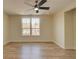 Spacious bedroom boasts lots of natural light, with freshly installed hardwood floors and a ceiling fan at 1456 S Gordon Sw St, Atlanta, GA 30310