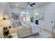 Comfortable bedroom with neutral tones, ceiling fan, and access to the bathroom at 1456 S Gordon Sw St, Atlanta, GA 30310